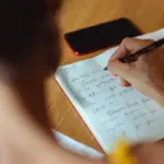 woman journaling about her vulnerability